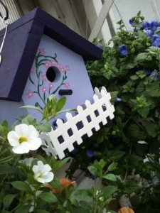 purple-birdhouse birdhouse and flowers